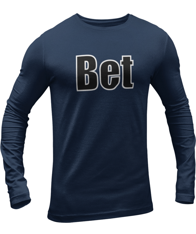 The design is the word Bet, written in black lettering with a white outline. Printed on a navy long sleeve shirt by Bella+Canvas.