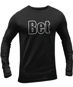 The design is the word Bet, written in black lettering with a white outline. Printed on a black long sleeve shirt by Bella+Canvas.