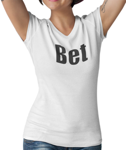 The design is the word Bet, written in black lettering with a white outline. Printed on a well-fitted white v-neck ladies tee.  