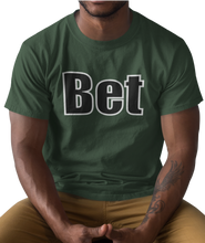 Load image into Gallery viewer, The design is the word Bet, written in black lettering with a white outline. Printed on a simply great forest green tee.