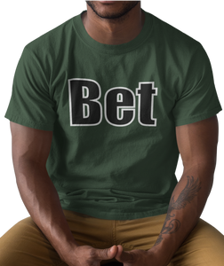 The design is the word Bet, written in black lettering with a white outline. Printed on a simply great forest green tee.