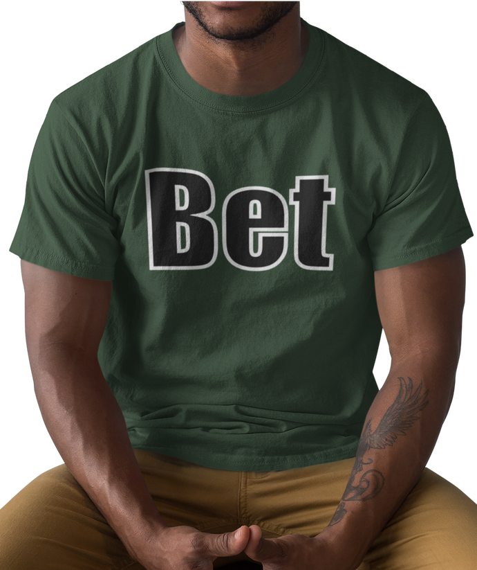 The design is the word Bet, written in black lettering with a white outline. Printed on a simply great forest green tee.