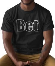 Load image into Gallery viewer, The design is the word Bet, written in black lettering with a white outline. Printed on a simply great black tee.