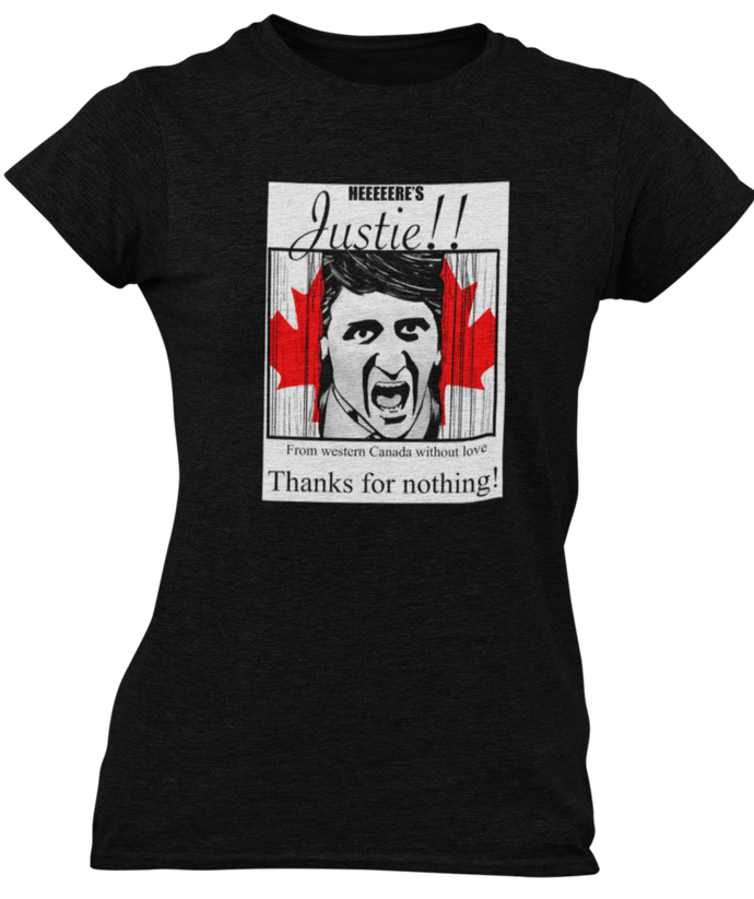 The design is Justin Trudeau pushing his head between a door painted like the Canadian flag. Written above are the words 'Here's Justie!!' written below is 'From western canada without love. Thank for nothing!'. Printed on a black ladies tee.