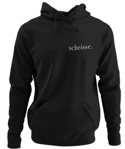 The design is the word scheisse. in white lettering. The design is printed on the left side of this black classic hoodie.