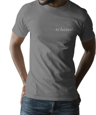 The design is the word scheisse. in white lettering. The design is printed on left side of this coal grey simply great tee.