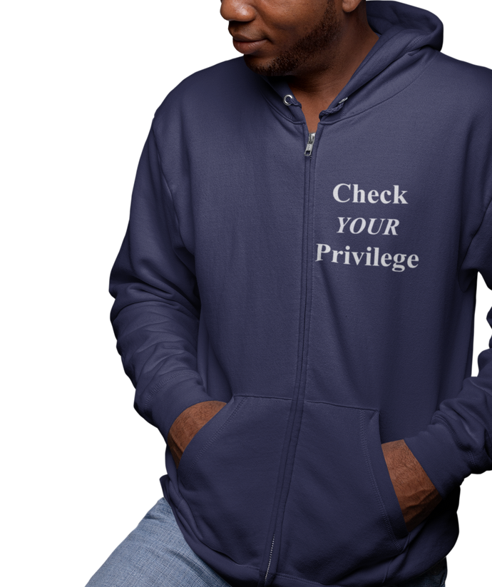 The design is the words 'check your privilege' in white lettering. The design is printed on a navy blue zip-up hoodie to the left of the zipper.