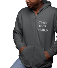 Load image into Gallery viewer, The design is the words &#39;check your privilege&#39; in white lettering. The design is printed on a dark grey heather zip-up hoodie to the left of the zipper.