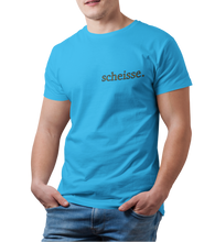 Load image into Gallery viewer, The design is the word scheisse. in brown lettering. The design is printed on the left side of the sapphire tee.