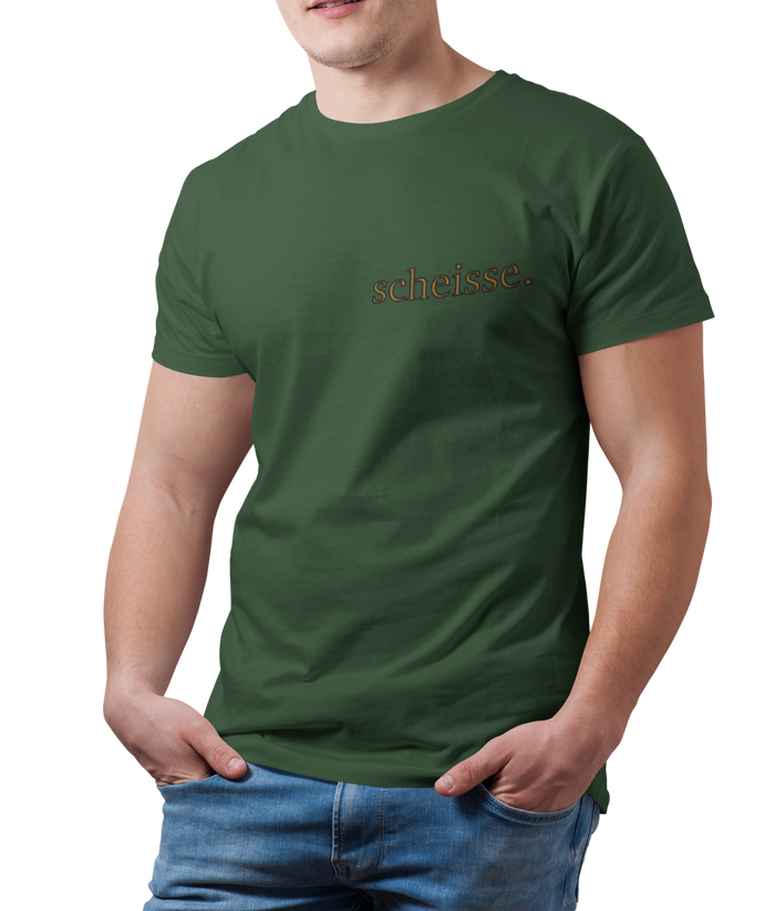 The design is the word scheisse. in brown lettering. The design is printed on the left side of the forest green tee.