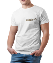 Load image into Gallery viewer, The design is the word scheisse. in brown lettering. The design is printed on the left side of the white tee.