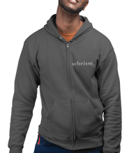 Load image into Gallery viewer, The design is the word scheisse. written in white lettering. The design is on the left side of the zipper on this charcoal heather hoodie.